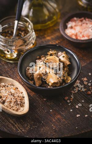 Truffle mushroom served with truffle infused olive oil and sea salt Stock Photo