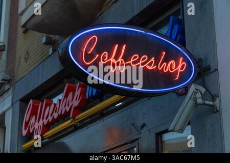 Coffeeshop neonsign logo glowing in the colors Red and blue at a Coffeeshop in Rotterdam. Stock Photo