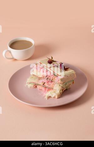 Trendy dessert handicraft chocolate with air filling, white and pink pismaniye and coffee on pink background. Vertical. Close up. Stock Photo