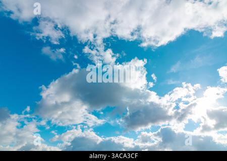 Scenic Sky photo. A harmonious combination of soft clouds and clear blue tones. Stock Photo