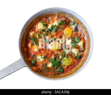 Breakfast shakshuka in frying pan isolated cutout on white Stock Photo