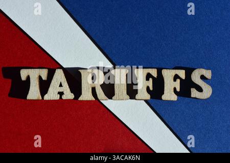 Tariffs, word in wooden alphabet letters isolated on red, white and blue background Stock Photo