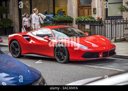 London, UK - September 14, 2023: Red Ferrari 488 sports car parked in Mayfair area. Stock Photo