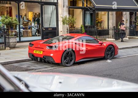 London, UK - September 14, 2023: Red Ferrari 488 sports car parked in Mayfair area. Stock Photo