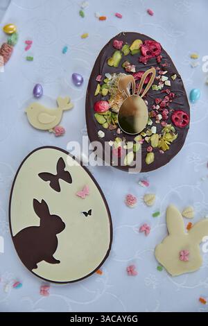 Dubai chocolate. Elegant handmade easter chocolate eggs await spring celebrations, garnished with pistachios and dried fruits, capturing heartfelt joy Stock Photo