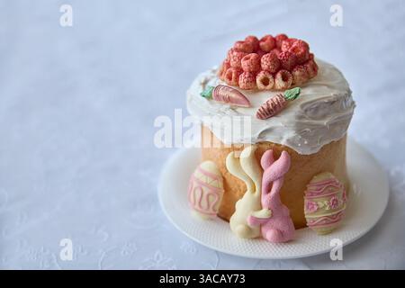 Resembling joy, this beautiful Easter Paska cake topped with plump raspberries embodies celebration, perfect for spreading springtime happiness or hig Stock Photo