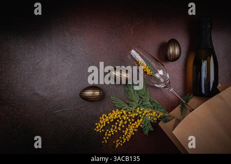 Elegant Easter still life with champagne and mimosa flowers Stock Photo