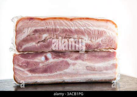 Montenegro local bacon vacuum packed made of red meat pork called Slanina with texture of lard fat macro closeup Stock Photo