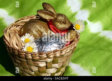 Easter Bunny with Silver and Gold Eggs Stock Photo
