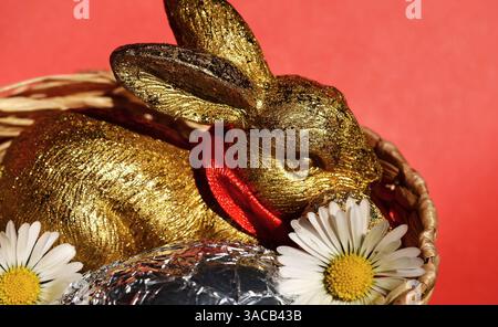 Easter Bunny with Silver Egg in Baske Stock Photo