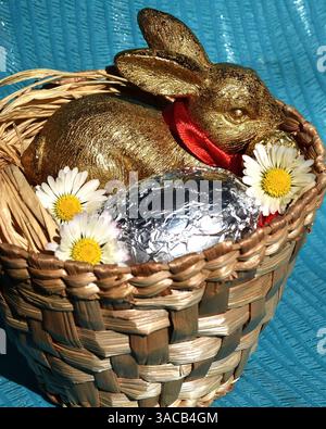 Gold Easter Bunny with Daisies Stock Photo