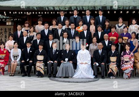 Commemorative wedding photo of bride, groom and extended family at a Japanese Shinto marriage ceremony at Meiji Jingu shrine in Tokyo, Japan. Stock Photo