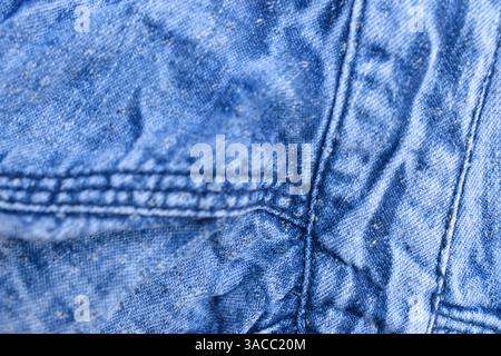 Folded Blue Denim Shirt Fabric Texture Close Up Background Stock Photo
