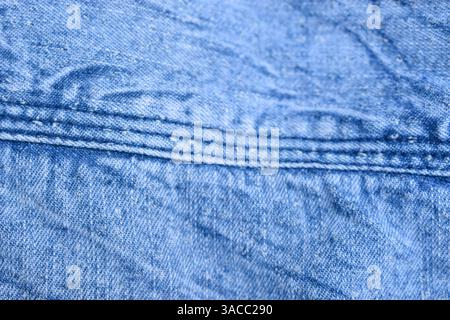Folded Blue Denim Shirt Fabric Texture Close Up Background Stock Photo
