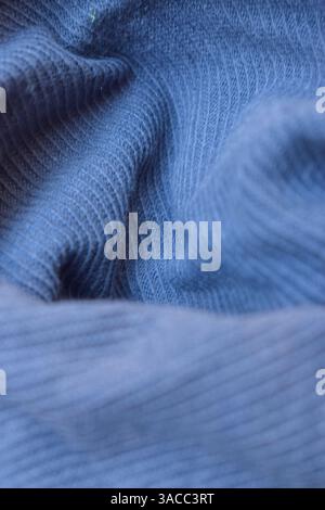 Folded Blue Denim Shirt Fabric Texture Close Up Background Stock Photo