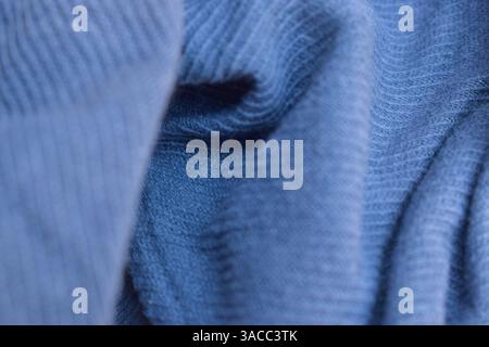 Folded Blue Denim Shirt Fabric Texture Close Up Background Stock Photo