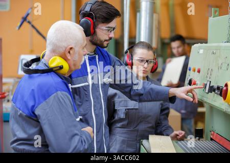 man and woman with machine cnc Stock Photo