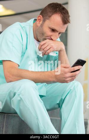modern medical surgeon using smart phone Stock Photo