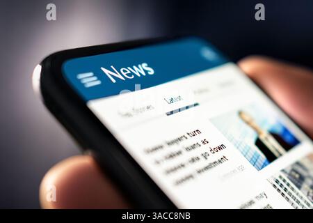 News and press. Media release. Newspaper reading with phone. Digital online article and headlines on website. Report, publication or blog. Stock Photo