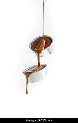 Flying Molten Chocolate Cakes with Dripping chocolate – Waterfall Dessert Scene on White Background Stock Photo