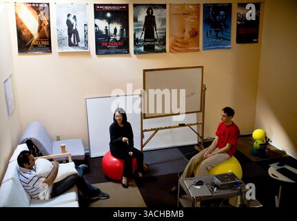 Feb 08, 2008 - Mountain View, California, USA - Left to right, engineer VIJAY RAHGUNATHAN, co-founder SANDY JEN, and engineer MARK DOLINER "pow-wow" Friday, Feb. 8, 2008 at Meebo, a three-year-old instant messaging and chat room company in Mountain View, Calif. (Credit Image: © Dave Getzschman/ZUMA Press) Stock Photo