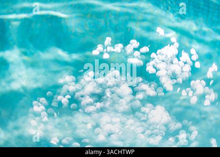 Summer pattern of swimming pool sea ocean morning sunlight reflection on water surface ripple blur bokeh background wallpaper, seascape ocean sparkle Stock Photo