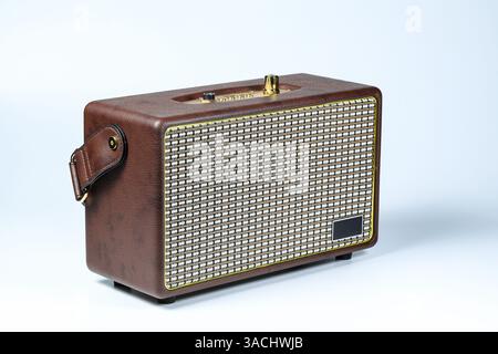 Brown Vintage style portable wireless speaker isolated on white background. Stock Photo