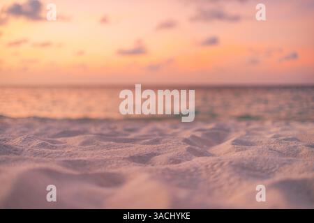 Closeup golden sand soft sunset light, beach seascape background Gentle waves warm colors meditation peaceful, serene coastal. Summer beach backgrond Stock Photo