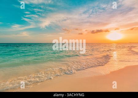 Golden sunset sky clouds tranquil beach seascape, calm waves gently splash shore, peaceful horizon glowing warm evening sunlight, serene ocean scene Stock Photo