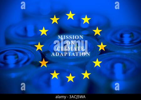 Close up of batteries with European flag and the text "Mission on climate adaptation" Stock Photo
