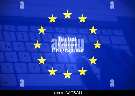 European flag with the text "Digital Europe Programme" Robot hands focus on a laptop button, representing the seamless operation of an advisor chatbot Stock Photo