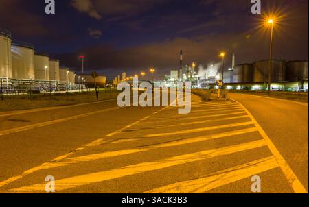 Night time view on illuminated heavy industry in the port of Antwerp in Belgium Stock Photo