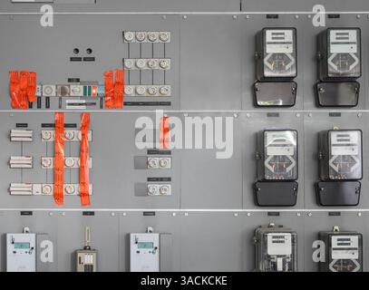 Old electrical power meter with tape over fuses in Switzerland. Power shut off due to unsafe conditions, hazard or non payment of bills. Labeling in G Stock Photo