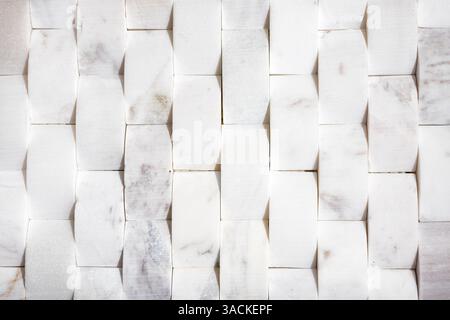 Arched white marble tiles for wall or floor. Natural white modern tile used for bathrooms, kitchen backsplash or featured walls. Upward curved or camb Stock Photo