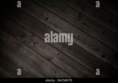 Wooden background with old diagonal dark wooden planks as a rustic texture Stock Photo