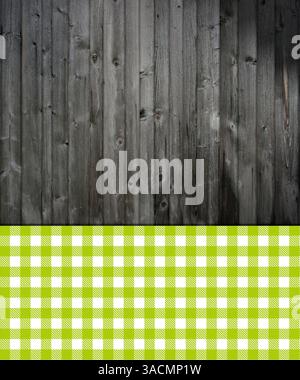 Grey rustic wooden background with checkered tablecloth pattern in green and white Stock Photo