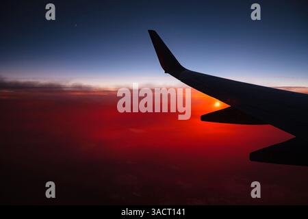 Aerial sunset view from airplane window above California, USA Stock Photo