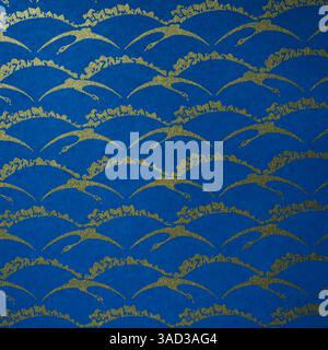 blue background with a pattern of a golden  flying cranes and curved lines Stock Photo