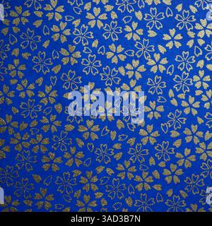 Traditional Japanese patterns with floral theme (gold cherry blossoms against blue background) Stock Photo