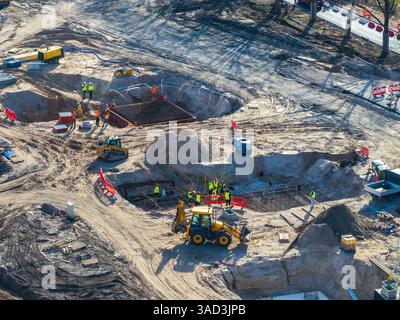 Active Construction Site with Workers and Machinery in Riga, Latvia Stock Photo