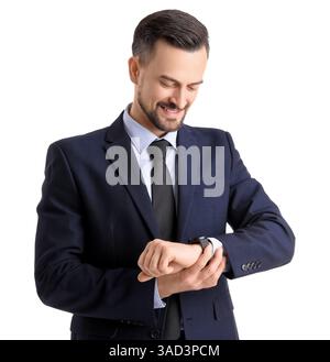 Handsome businessman looking at smartwatch on white background Stock Photo