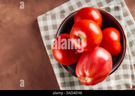 Fresh Red Tomatoes in Bowl on Checkered Napkin, Copy Space Stock Photo