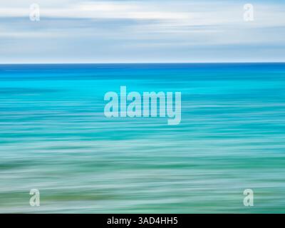 Blurred abstract of blue and green sea and sky. Stock Photo