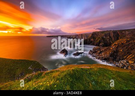 United Kingdom, England, Cornwall. Carnewas, The Cove at Bedruthan Steps at Sunset Stock Photo