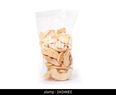 Dried apple slices in plastic bag. Pile of yellow dehydrated apple slices. Used as healthy snack. Dry fruit package. White background. Selective focus Stock Photo