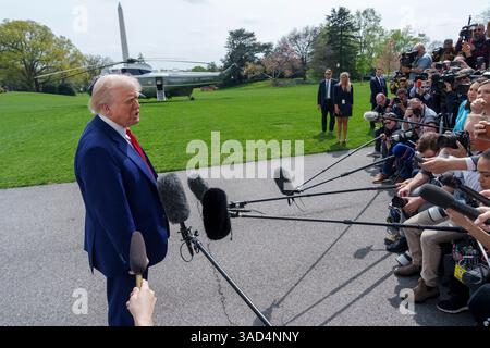 Washington, United States. 03rd Apr, 2025. U.S President Donald Trump speaks to the media during an impromptu press conference before departing aboard Marine One on the South Lawn of the White House, April 3, 2025 in Washington, DC The president is spending a three-day weekend at his Mar-a-Lago residence. Credit: Abe McNatt/White House Photo/Alamy Live News Stock Photo