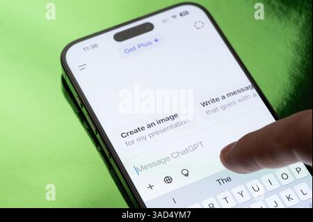New York, USA - March 30, 2025: Using ChatGPT AI app on smartphone screen close up view Stock Photo