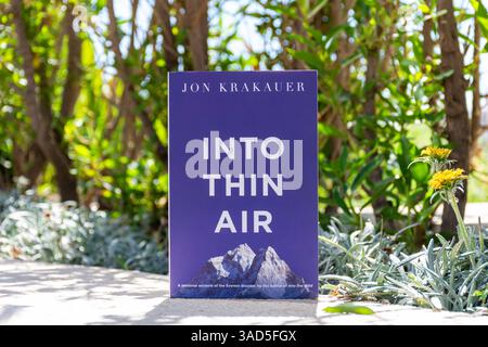 Close-up of Jon Krakauer's Into Thin Air Book in The Garden. Stock Photo