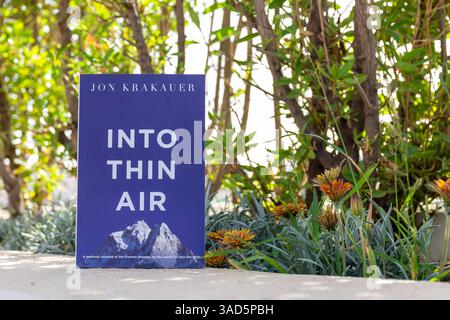 Close-up of Jon Krakauer's Into Thin Air Book in The Garden. Stock Photo