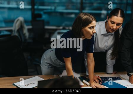 Diverse business team collaborating on an innovative project together Stock Photo